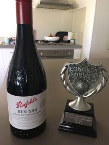 Trophy and wine bottle awarded for longest golf drive